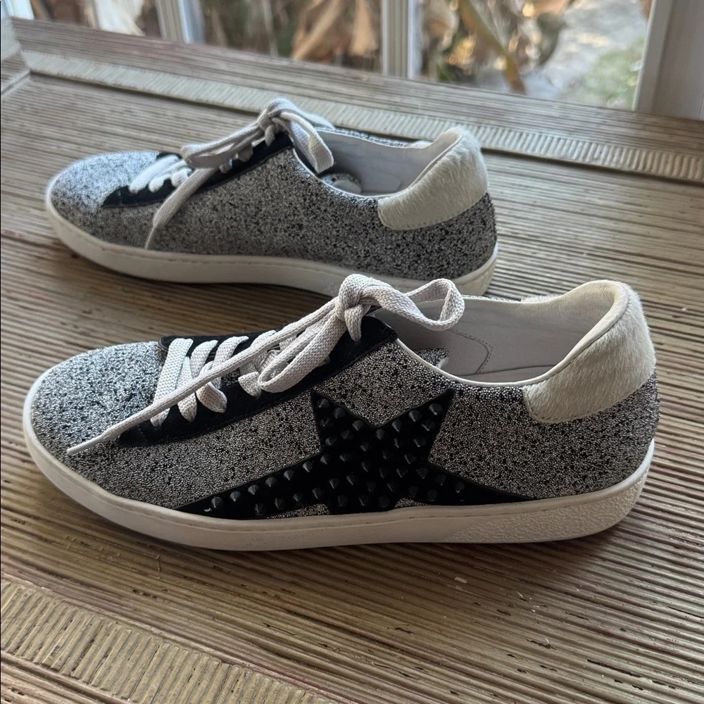 Lola Cruz silver metallic sneakers with a black raised star